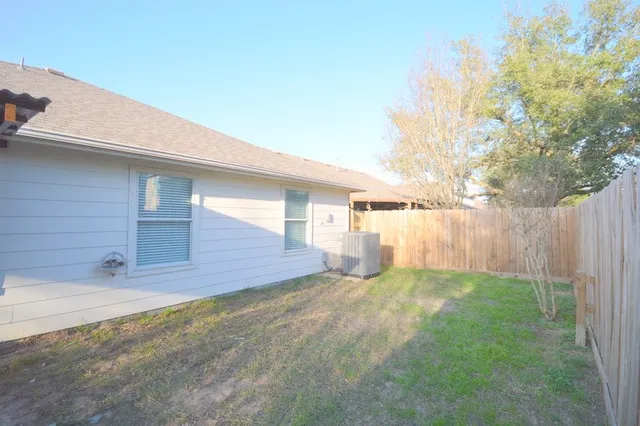 a view of a backyard with pathway