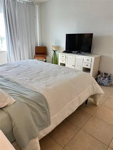 a bathroom with a sink a toilet a mirror and vanity