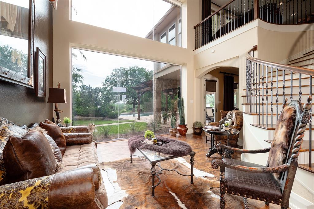 2312 Cactus Rio Lane Weatherford, TX 76087 - Photo 7 of 37 a balcony with furniture and a floor to ceiling window
