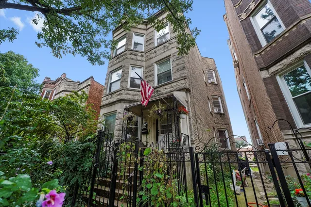 a view of a house with a tree