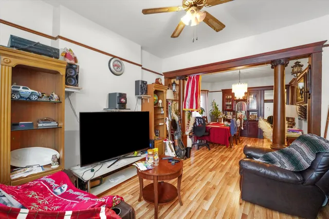 a bedroom with furniture and a flat screen tv