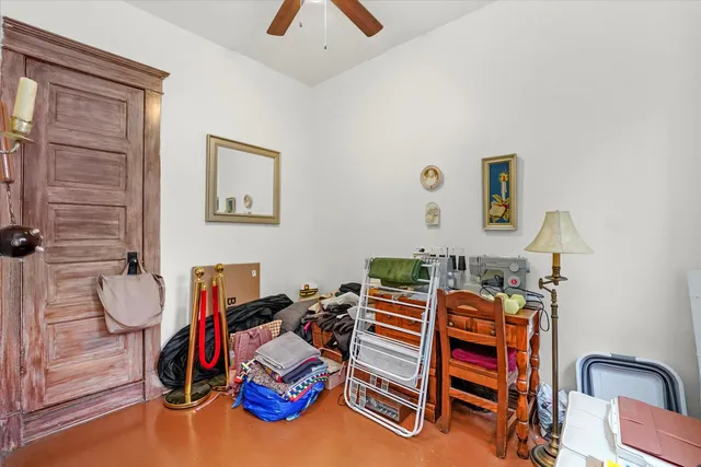 a bedroom with furniture and a closet