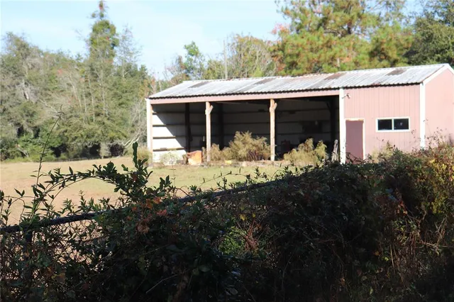 a view of a house with yard and covered with snow