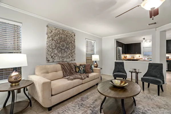 a living room with furniture and a table