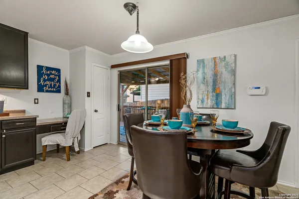 a dining room with furniture and window