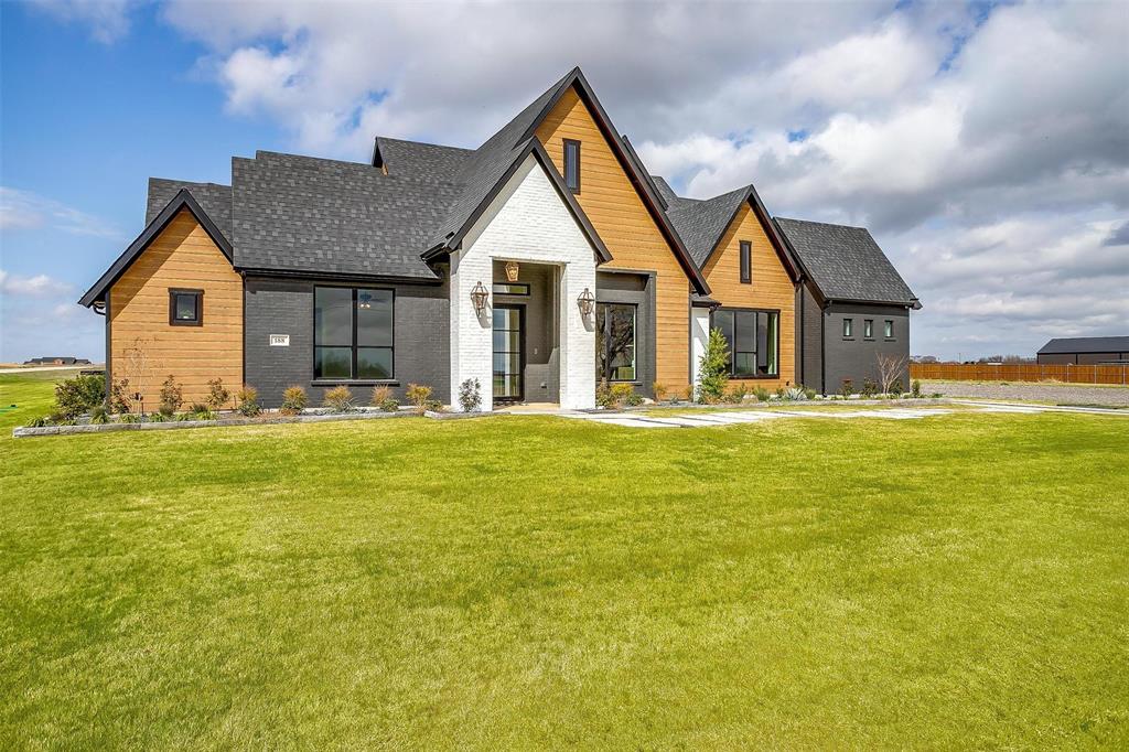 188 Ozro Road Venus, TX 76084 - Photo 2 of 32 a front view of house with patio and yard