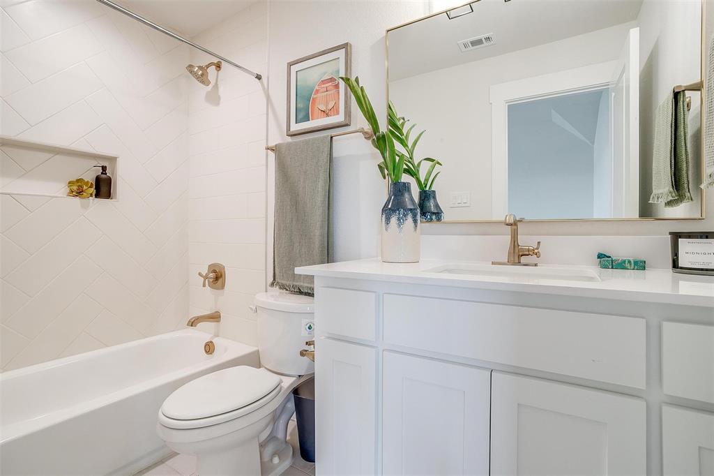 188 Ozro Road Venus, TX 76084 - Photo 22 of 32 a bathroom with a granite countertop sink mirror vanity and toilet