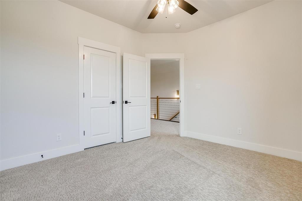188 Ozro Road Venus, TX 76084 - Photo 23 of 32 an empty room with chandelier fan