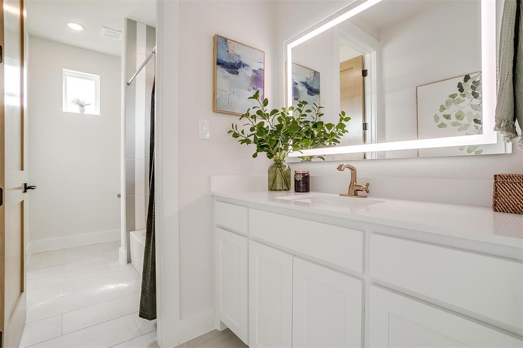 188 Ozro Road Venus, TX 76084 - Photo 26 of 32 a bathroom with a sink a vanity and a mirror