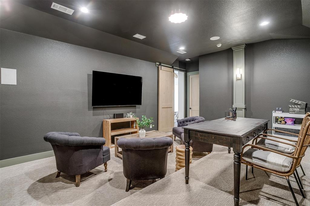188 Ozro Road Venus, TX 76084 - Photo 28 of 32 a work room with furniture and a flat screen tv