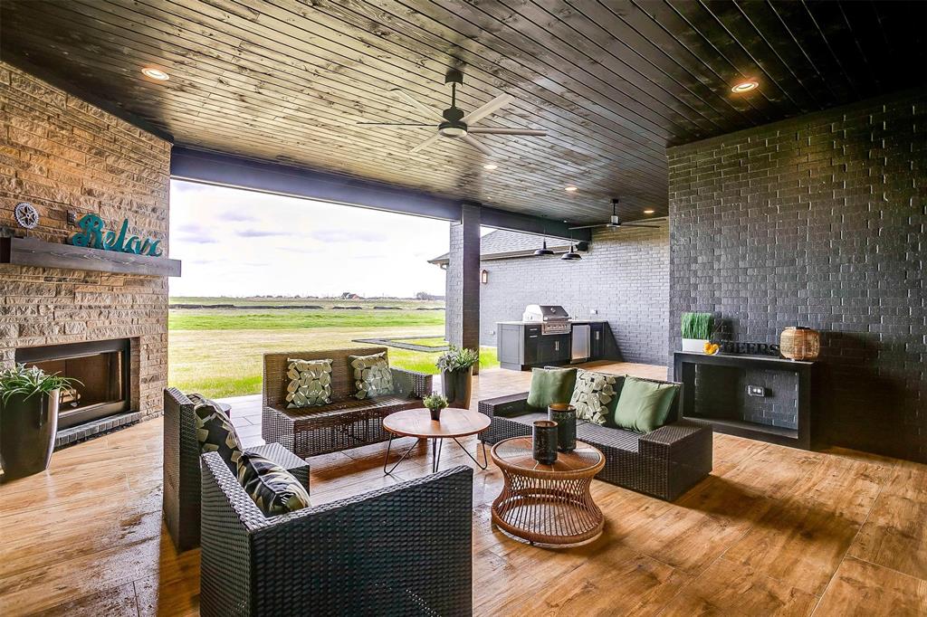 188 Ozro Road Venus, TX 76084 - Photo 29 of 32 a living room with furniture a fireplace and a table