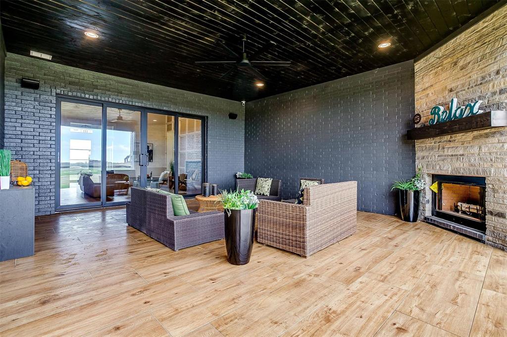 188 Ozro Road Venus, TX 76084 - Photo 30 of 32 a living room with furniture and a fireplace