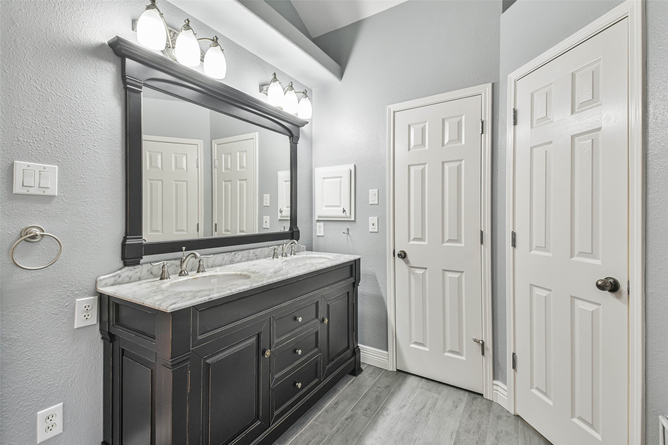 20942 Wind Field Lane Spring, TX 77379 - Photo 27 of 46 a bathroom with a sink vanity granite and a mirror