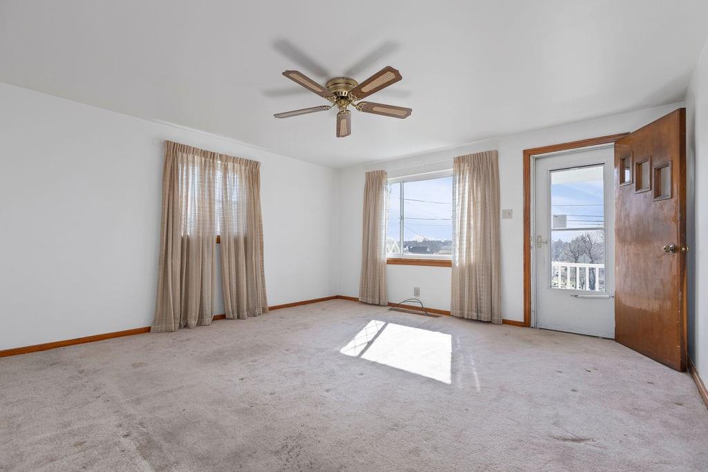 60 Herbst Road Coraopolis, PA 15108 - Photo 4 of 17 a view of a livingroom with a ceiling fan and windows