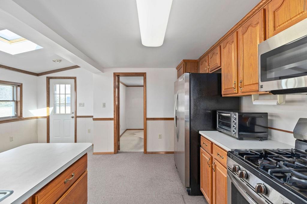 60 Herbst Road Coraopolis, PA 15108 - Photo 7 of 17 a kitchen with stainless steel appliances granite countertop a sink stove and refrigerator