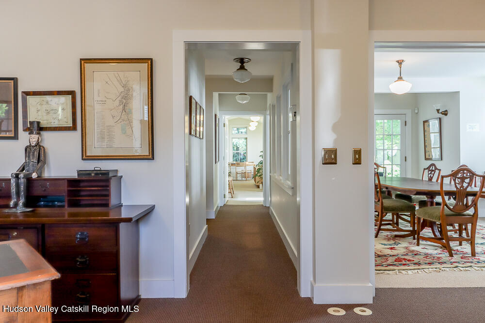 38 Main Street Chatham, NY 12037 - Photo 11 of 28 a view of a hallway and dining room with furniture