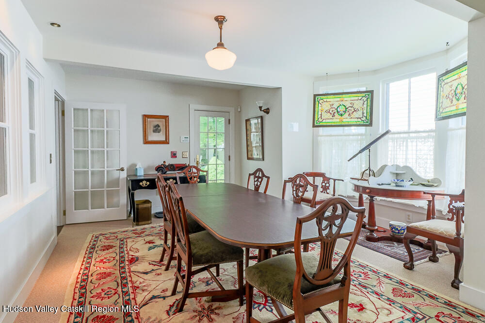 38 Main Street Chatham, NY 12037 - Photo 12 of 28 a view of a dining room with furniture and wooden floor