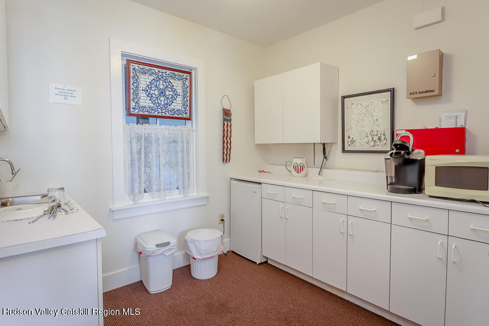 38 Main Street Chatham, NY 12037 - Photo 14 of 28 a spacious bathroom with a sink mirror and toilet