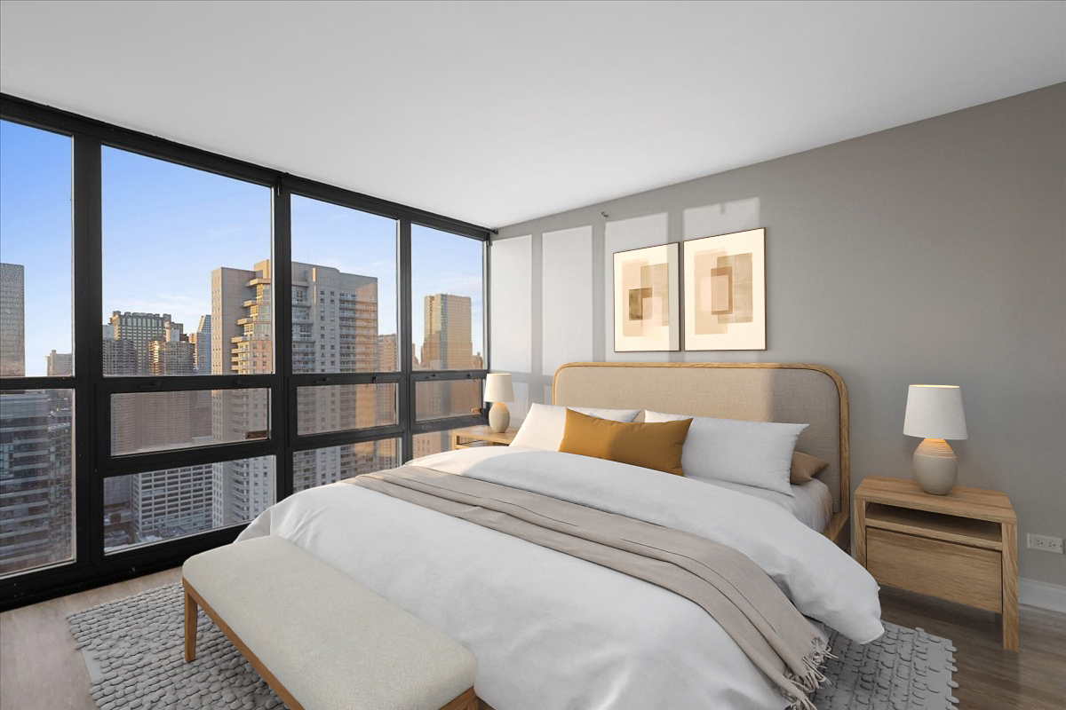 10 East Ontario Street, Unit 480102 Chicago, IL 60611 - Photo 25 of 41 a bedroom with a large bed and a lamp next to a window