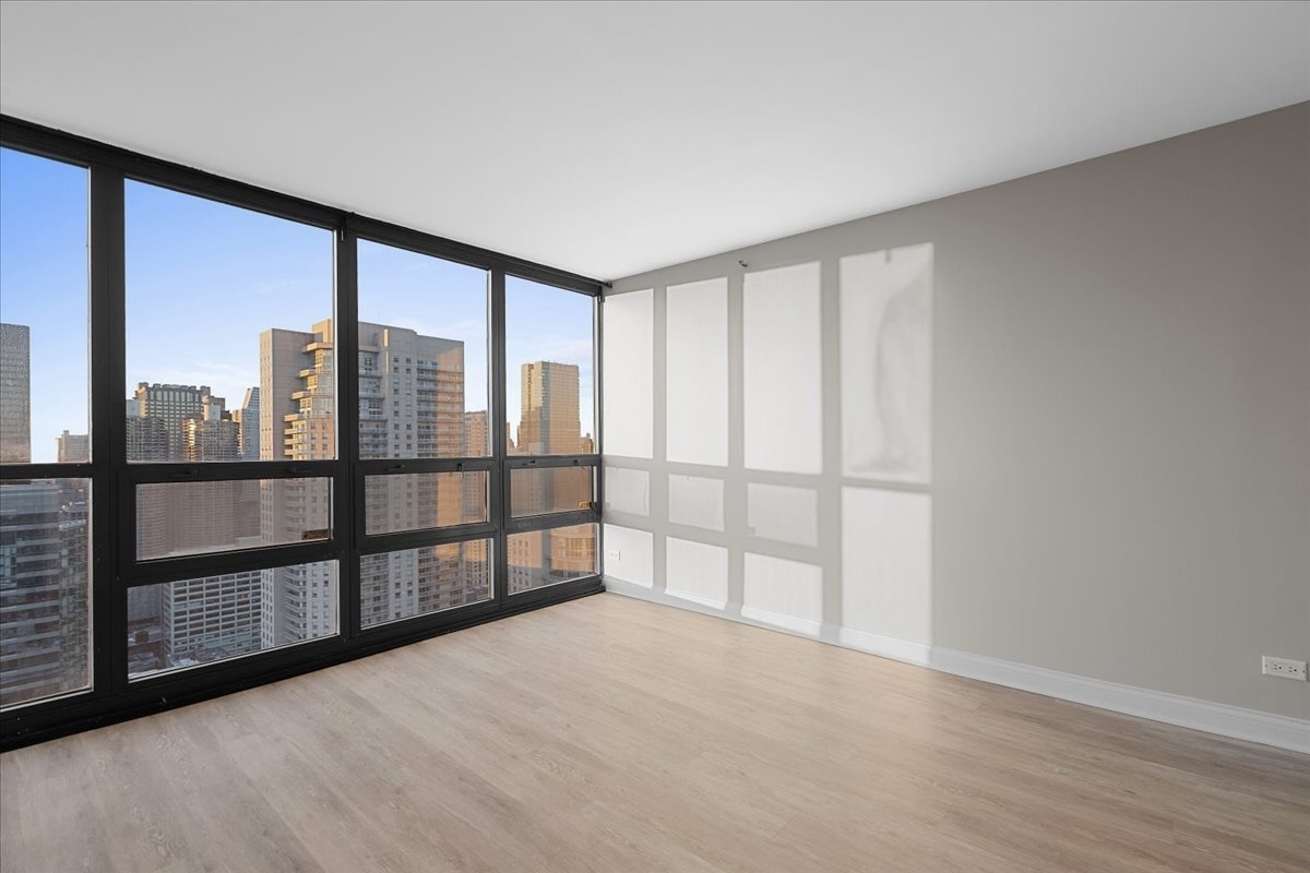 10 East Ontario Street, Unit 480102 Chicago, IL 60611 - Photo 26 of 41 a view of an empty room with a balcony