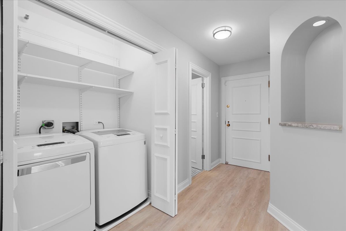 10 East Ontario Street, Unit 480102 Chicago, IL 60611 - Photo 32 of 41 a view of storage and utility room with washer and dryer