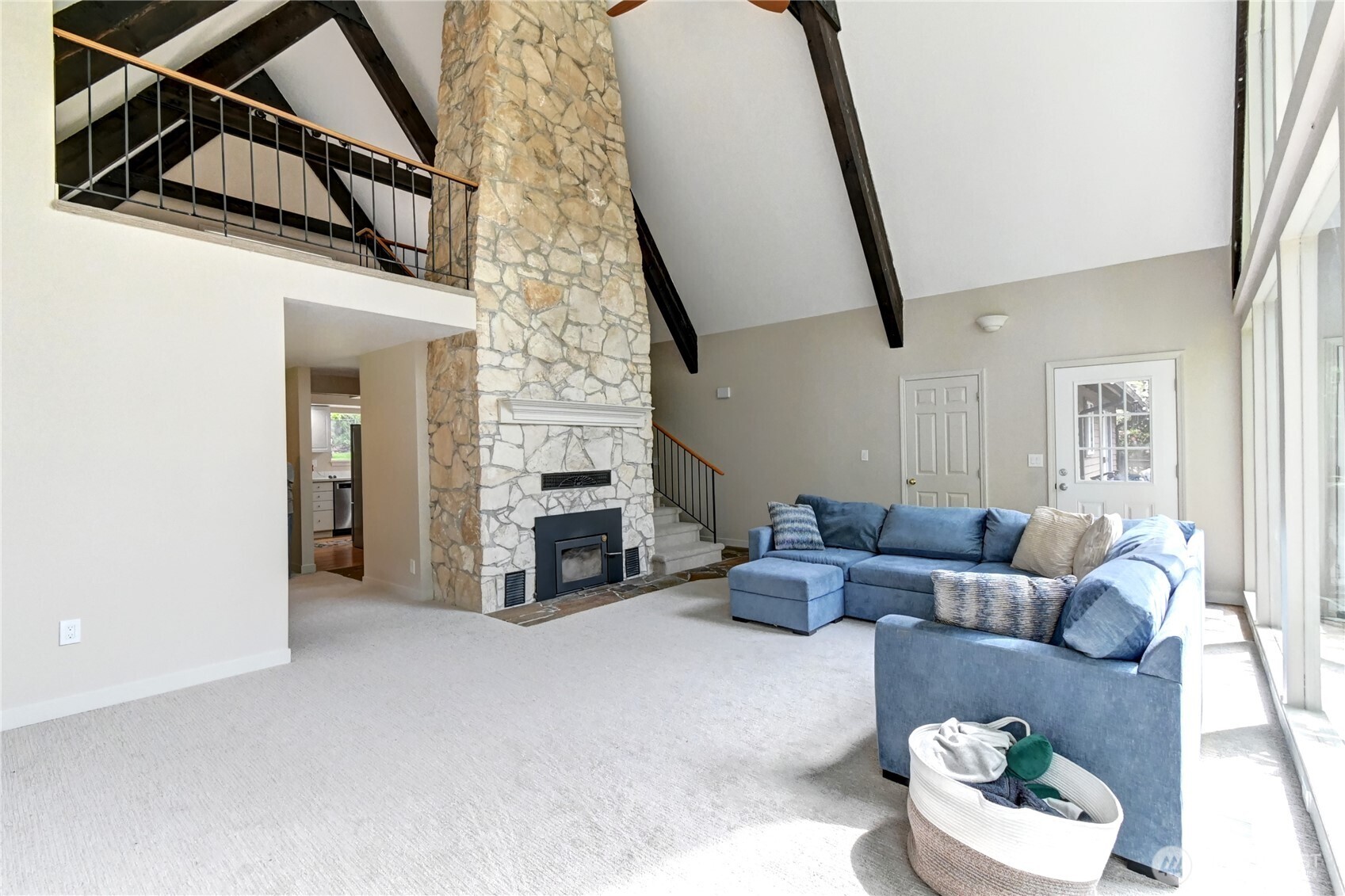 28539 Northeast Tolt Hill Road Carnation, WA 98014 - Photo 12 of 36 a living room with furniture and a fireplace