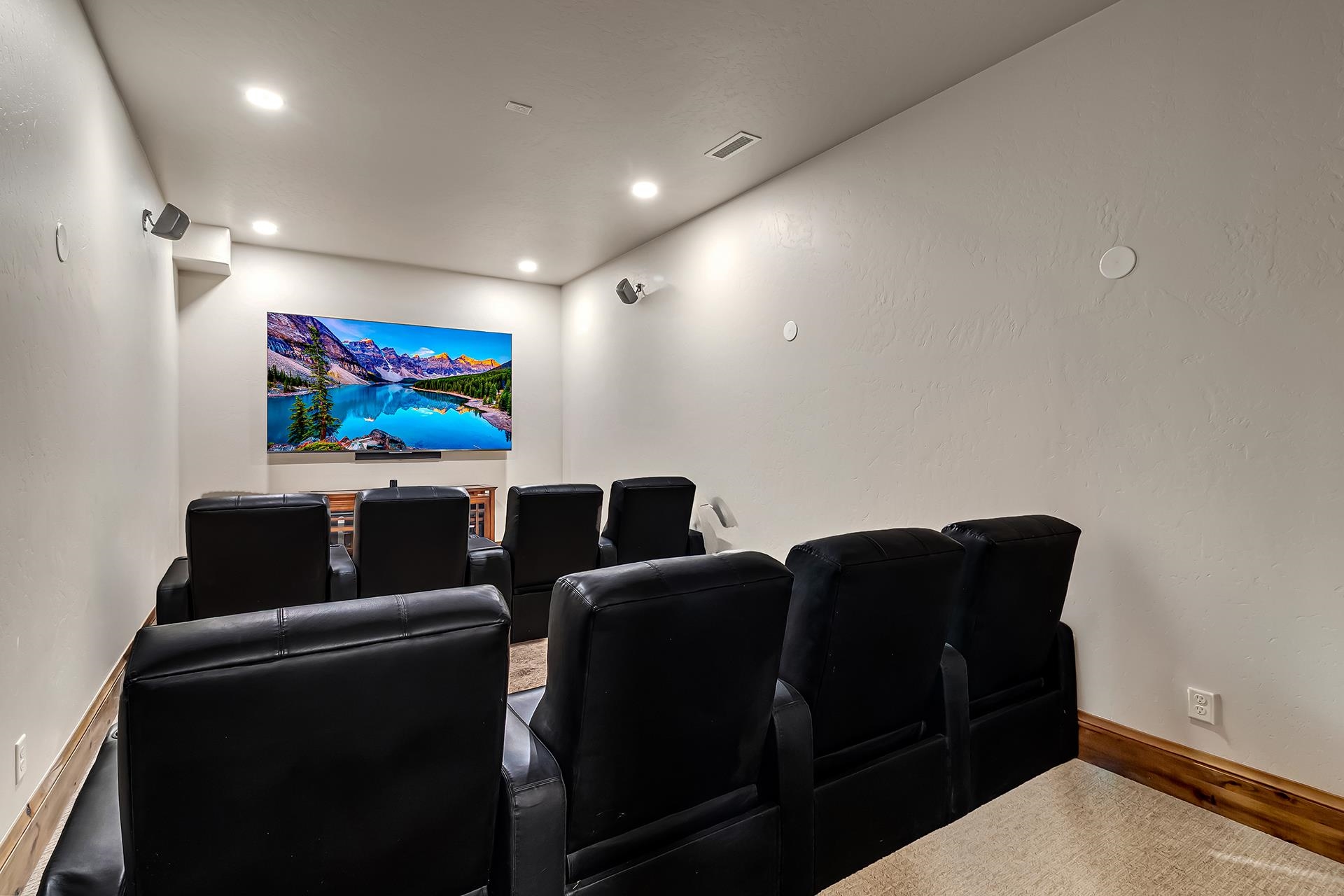 2440 J Road Grand Junction, CO 81505 - Photo 20 of 42 a media room with lots of chairs and a projector screen