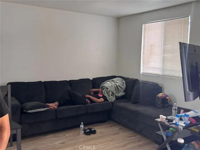 a kitchen with granite countertop a sink cabinets and stainless steel appliances