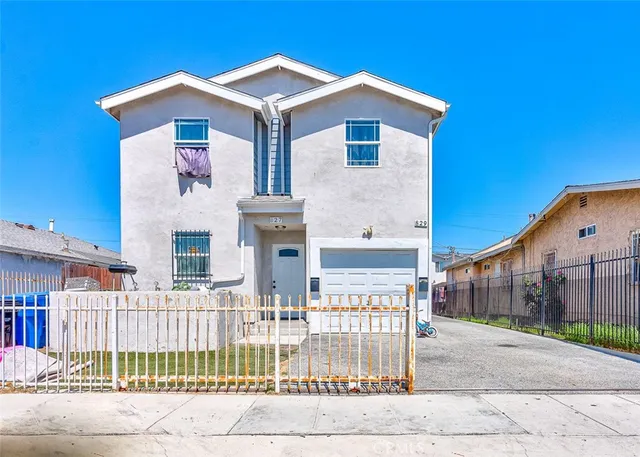 a front view of a house with garage