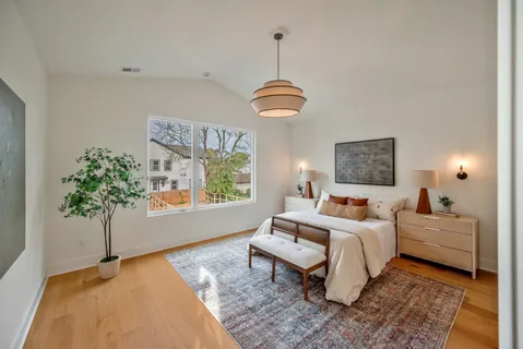 a bed room with a bed and a window