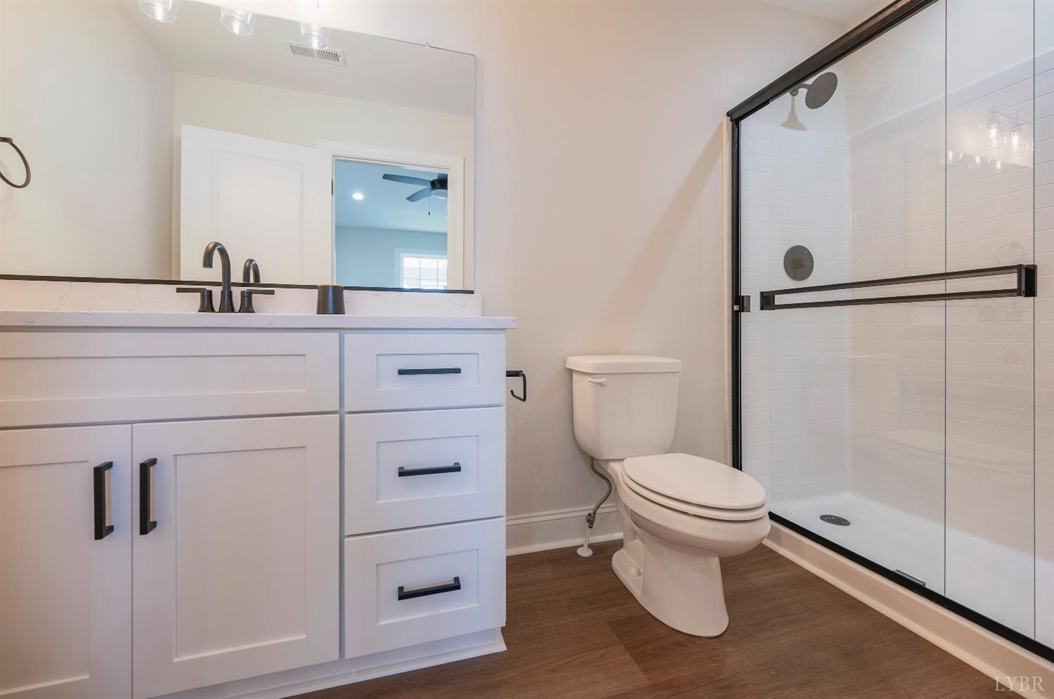536 Leesville Road, Unit 207 Lynchburg, VA 24502 - Photo 22 of 47 a bathroom with a sink a toilet and shower