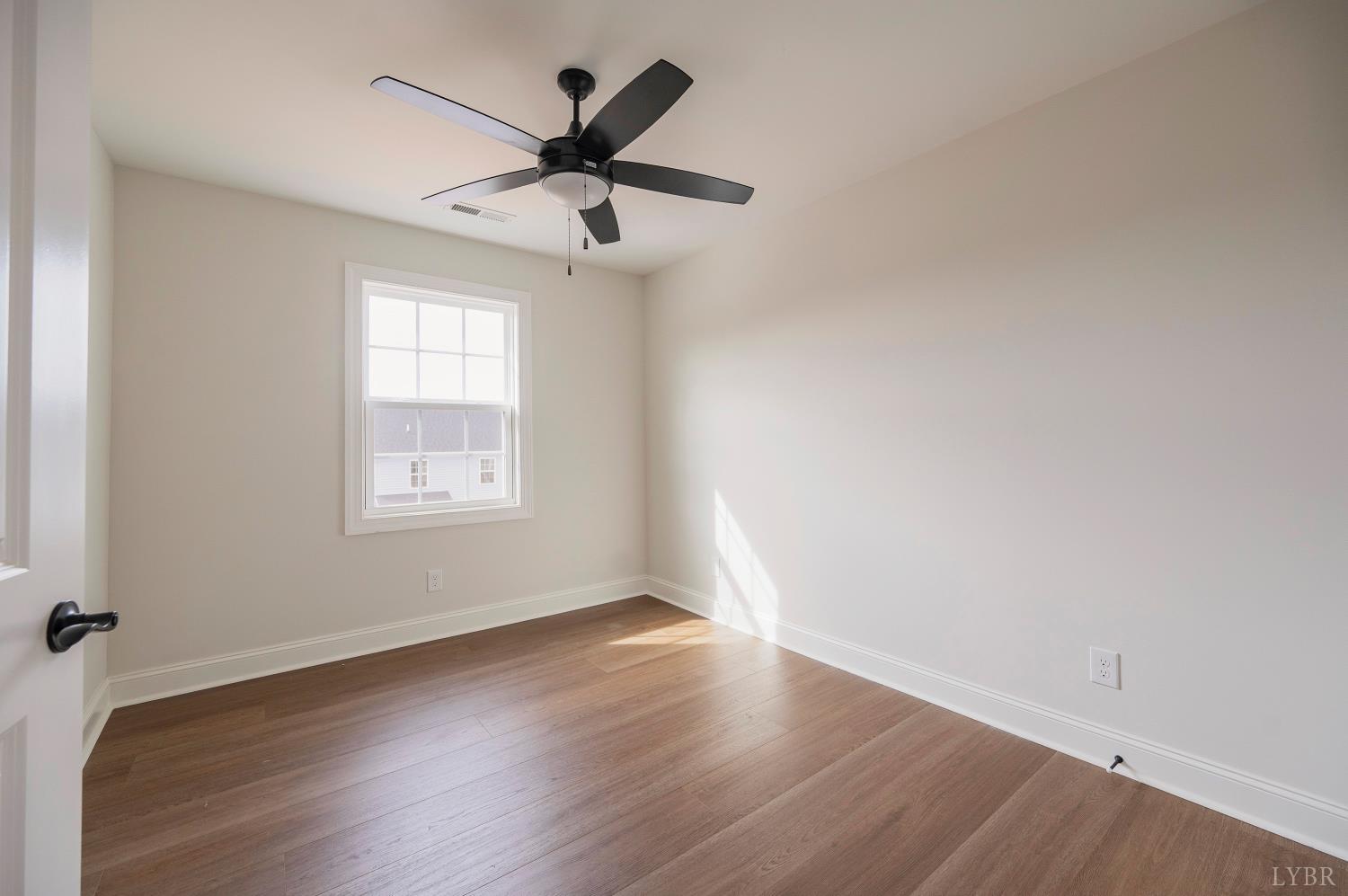 536 Leesville Road, Unit 207 Lynchburg, VA 24502 - Photo 27 of 47 wooden floor in an empty room with a window