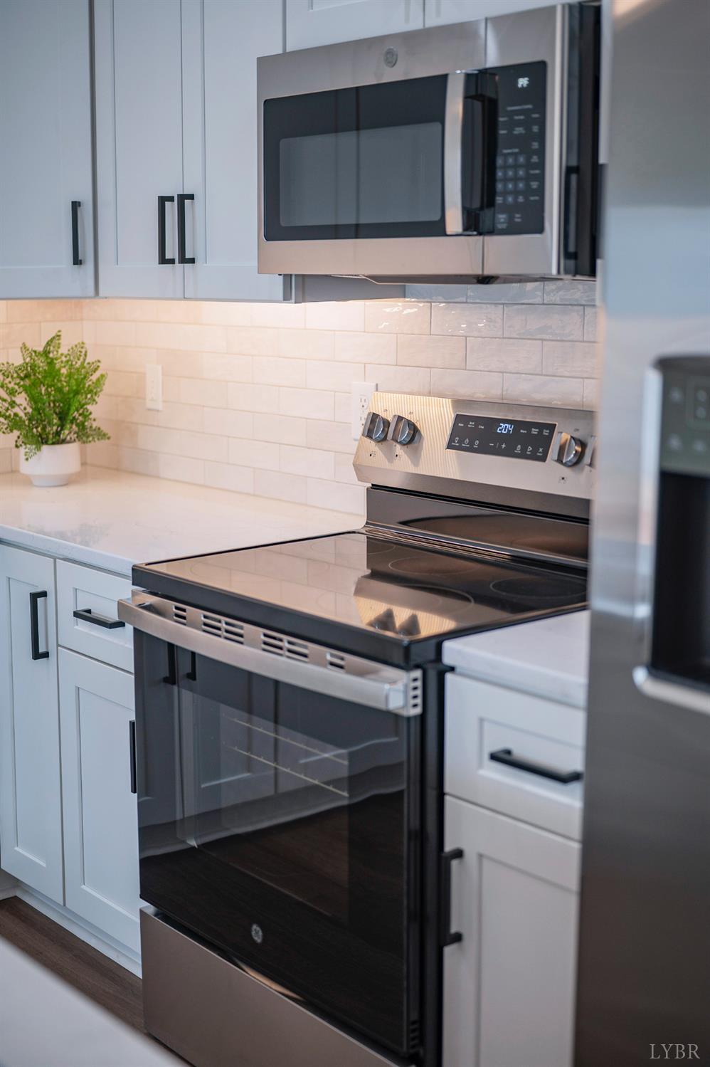 536 Leesville Road, Unit 207 Lynchburg, VA 24502 - Photo 36 of 47 a stove top oven sitting inside of a kitchen