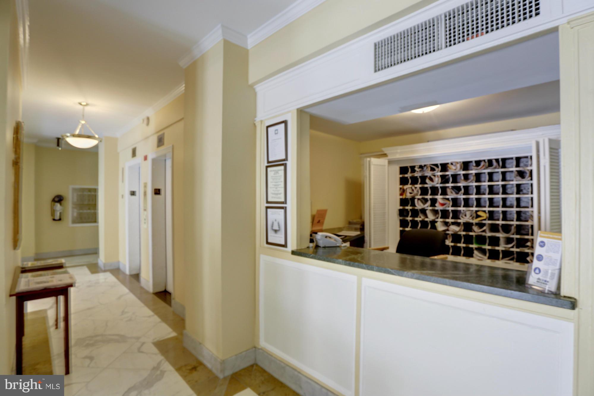 1954 Columbia Road Northwest, Unit 408 Washington, DC 20009 - Photo 4 of 12 a view of a bathroom with a tub and shower