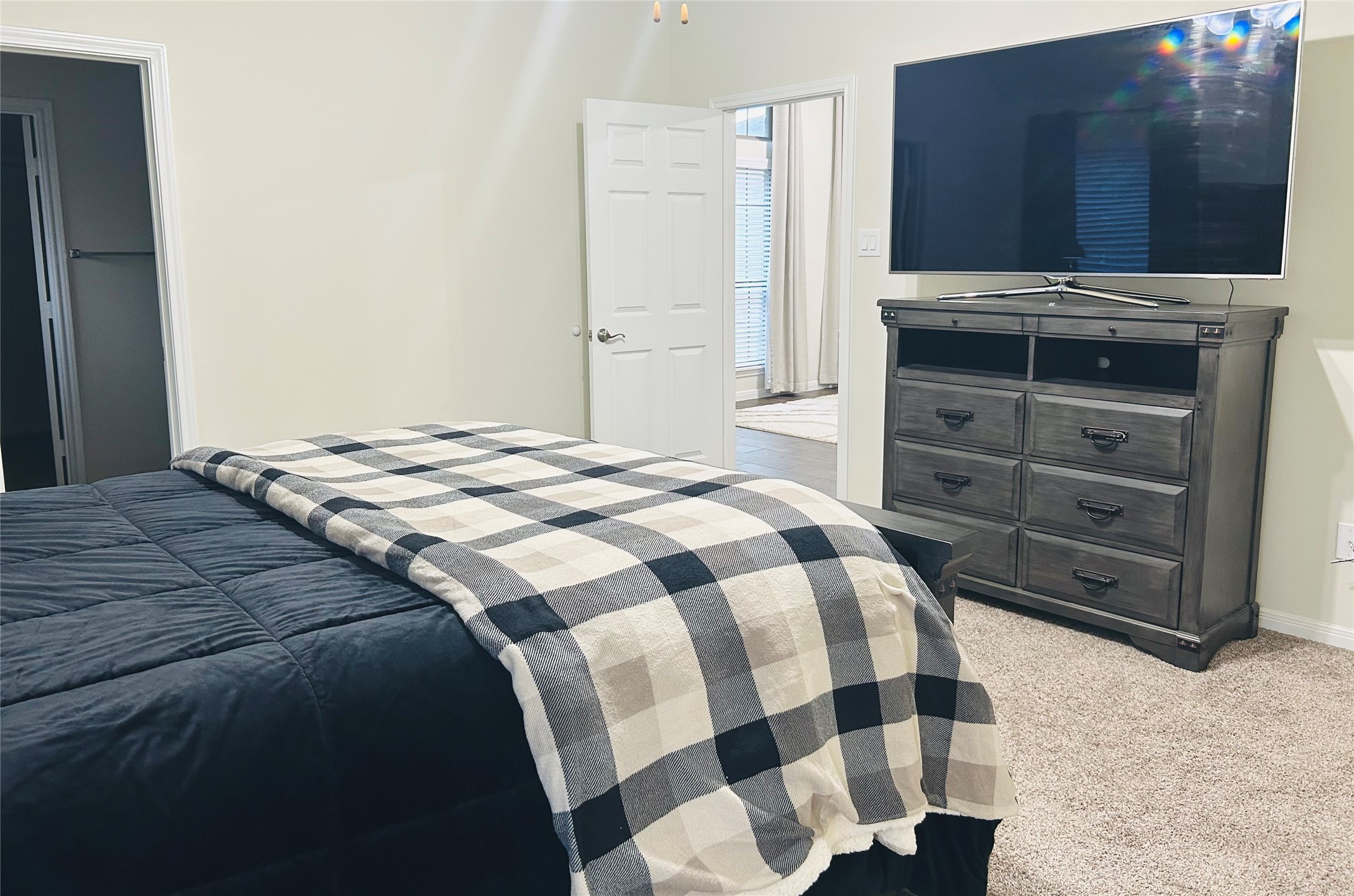 7114 Limestone Circle Manvel, TX 77578 - Photo 12 of 23 a bedroom with a bed and a television