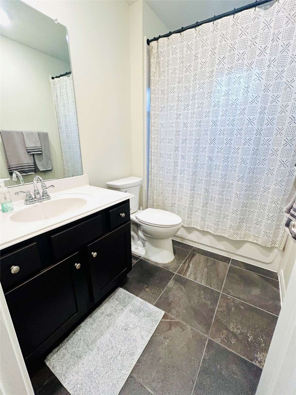 7114 Limestone Circle Manvel, TX 77578 - Photo 18 of 23 a bathroom with a sink vanity mirror and toilet