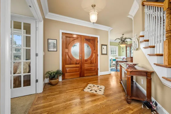 a kitchen with stainless steel appliances granite countertop a stove top oven a sink dishwasher and cabinets with wooden floor