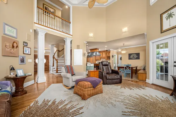a bed room with a bed and large windows