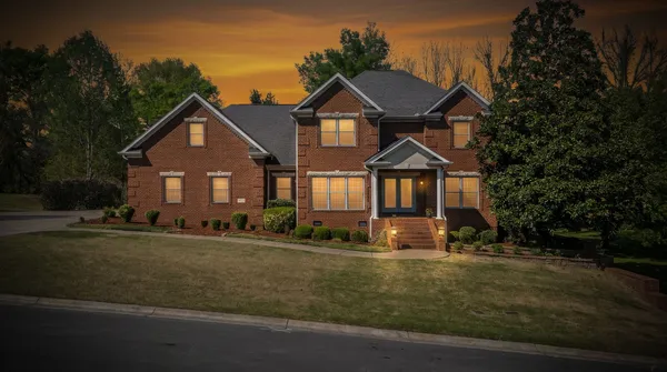 a front view of a house with a yard