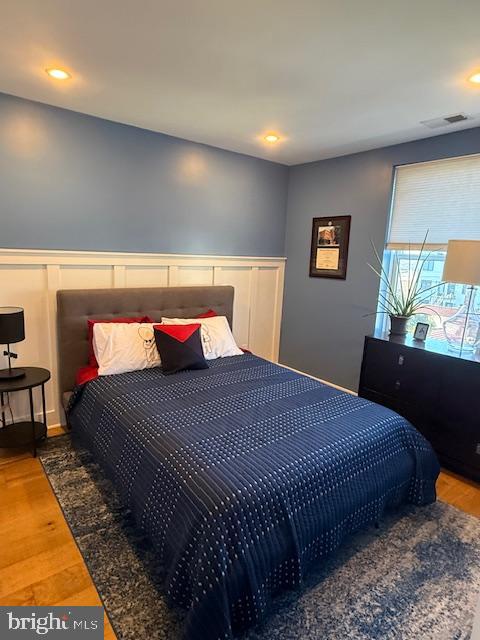 1221 Oates Street Northeast, Unit C Washington, DC 20002 - Photo 21 of 33 a bedroom with a bed and dresser