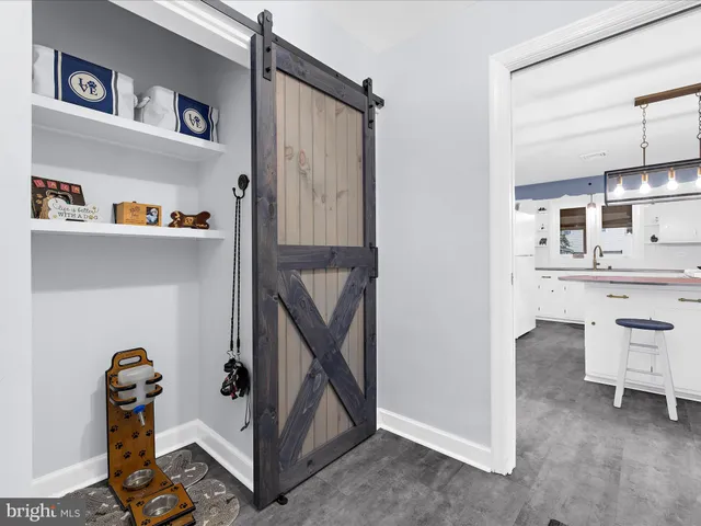 a bedroom with a bed and furniture