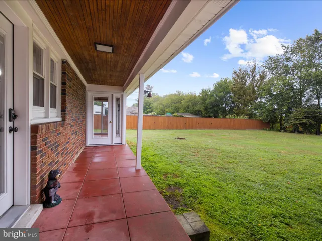 a view of yard with patio