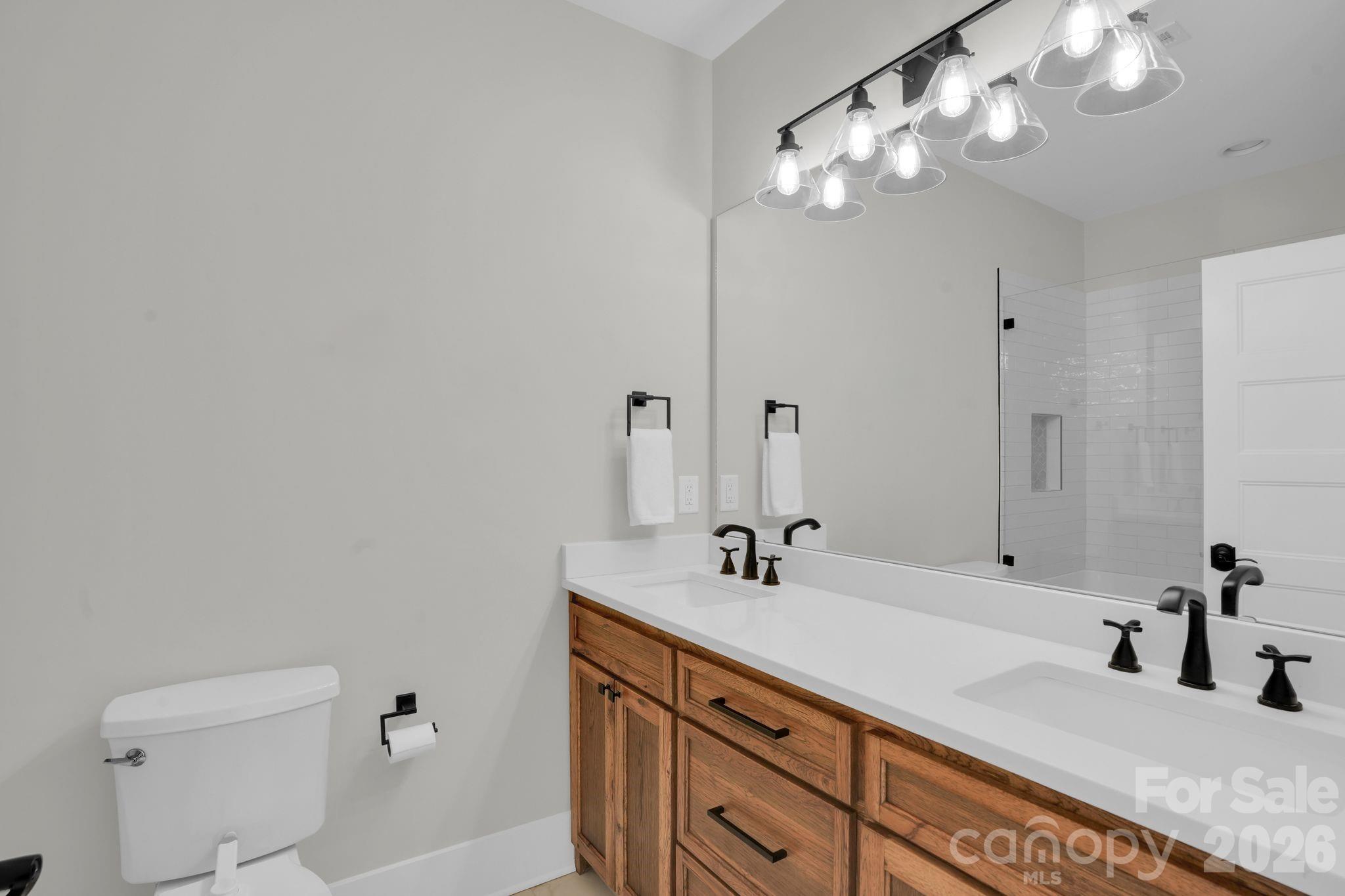 3134 Ranger Road Clover, SC 29710 - Photo 22 of 29 a bathroom with a double vanity sink and a mirror