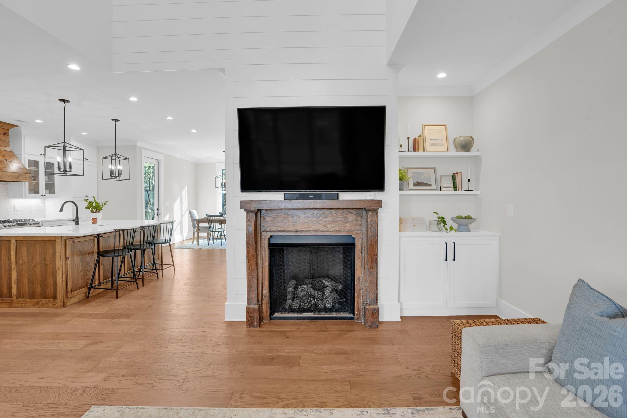 3134 Ranger Road Clover, SC 29710 - Photo 6 of 29 a living room with furniture a flat screen tv and a fireplace
