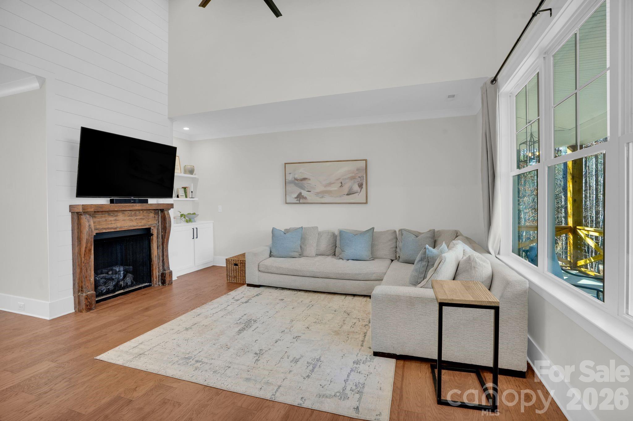 3134 Ranger Road Clover, SC 29710 - Photo 7 of 29 a living room with furniture a flat screen tv and a fireplace