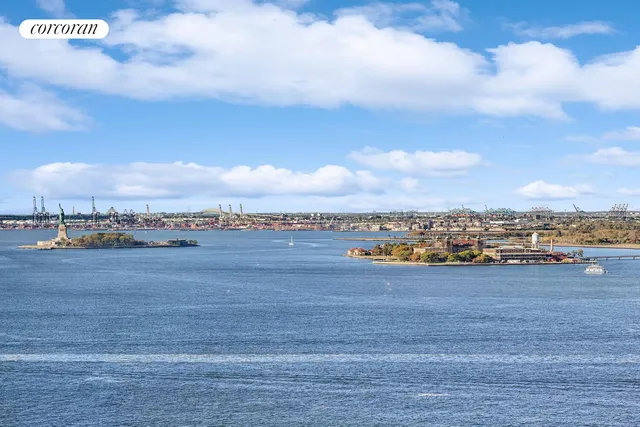 a view of a livingroom with furniture and a window