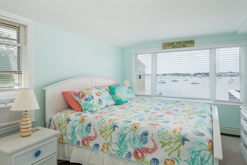 57 Oak Street Wareham, MA 02571 - Photo 12 of 42 a bedroom with a bed and a window