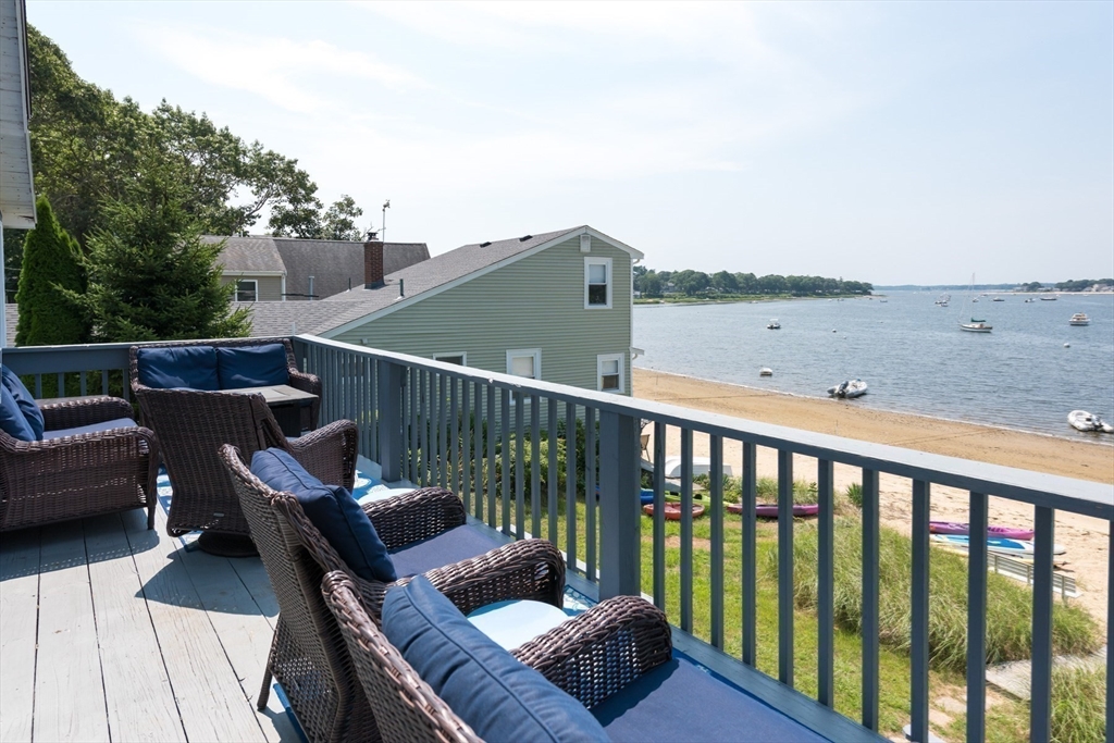 57 Oak Street Wareham, MA 02571 - Photo 17 of 42 a balcony with wooden floor table and chairs