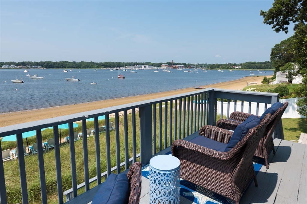 57 Oak Street Wareham, MA 02571 - Photo 18 of 42 a view of a balcony with chair and wooden floor