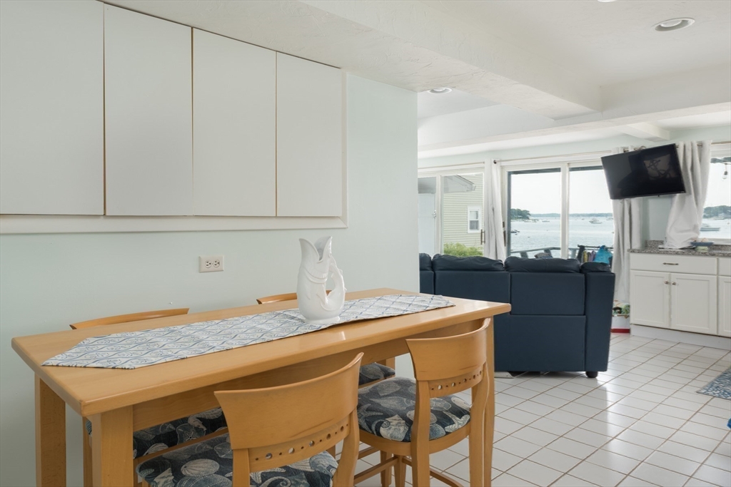 57 Oak Street Wareham, MA 02571 - Photo 19 of 42 a room with a table chairs and a view of kitchen